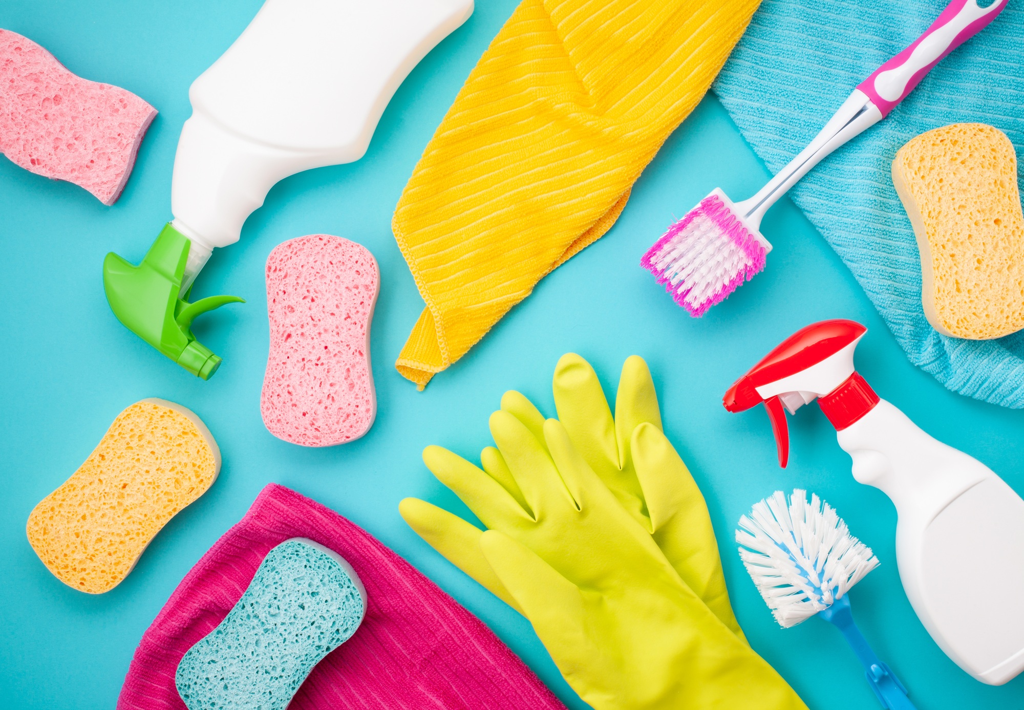 Detergents and cleaning accessories in pastel color. Cleaning service, small business idea. Top view